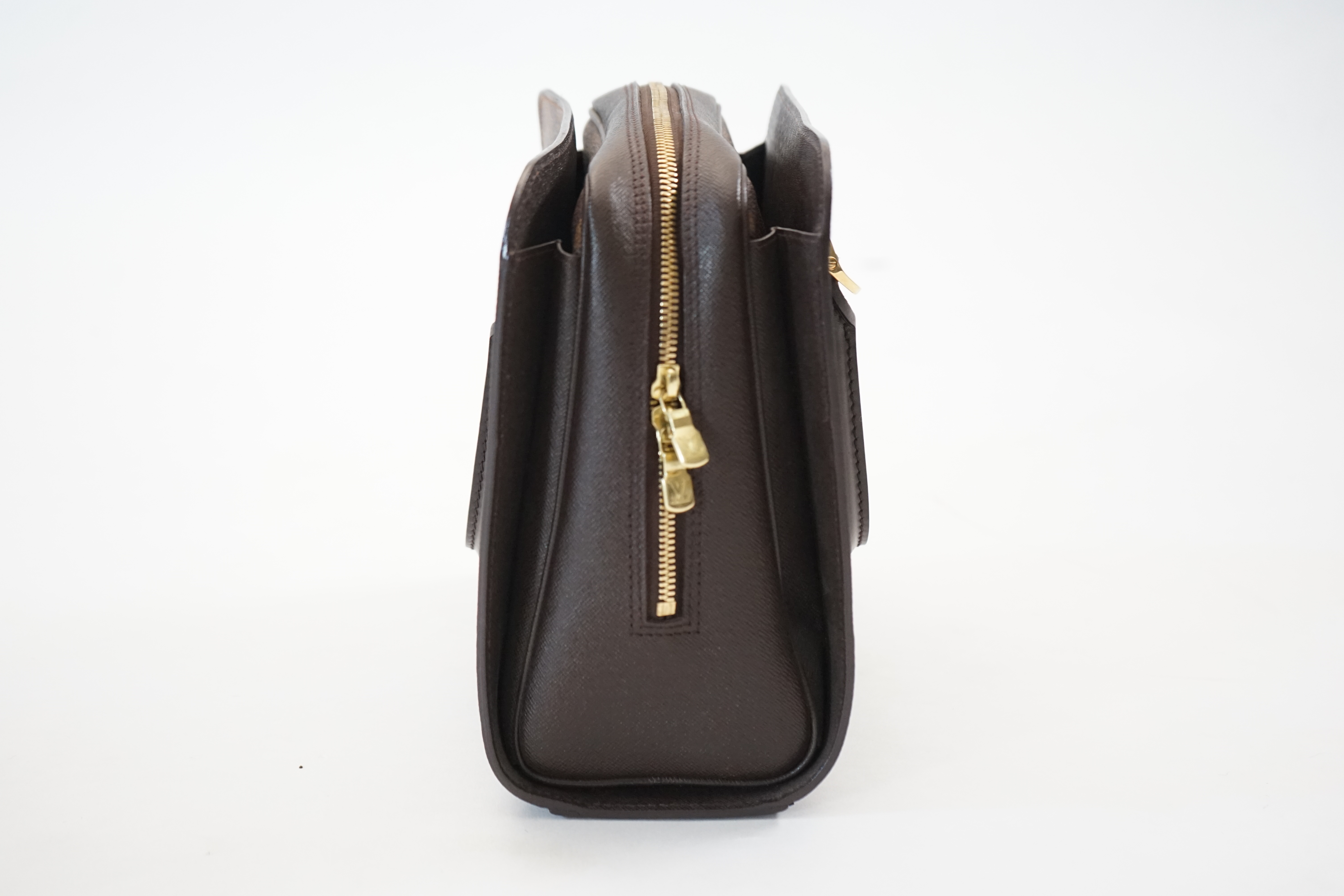 A Louis Vuitton Triana handbag, styled in Damier canvas width 26cm, depth 12cm, height 22cm handle 11cm